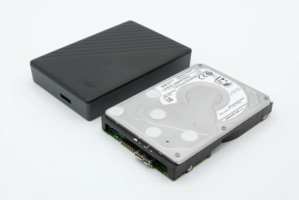 Disassembled WD external hard drive with cover removed, showing internal drive