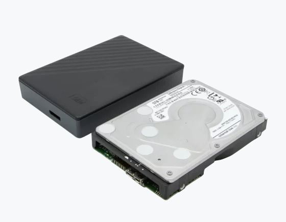 External hard drive with removed cover showing internal disk and components