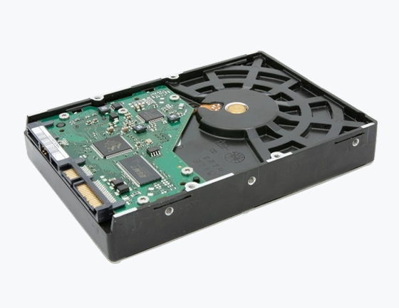 Internal hard drive with exposed circuit board and spindle motor.