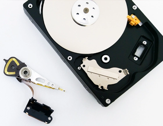 Open hard drive with removed read/write head assembly.